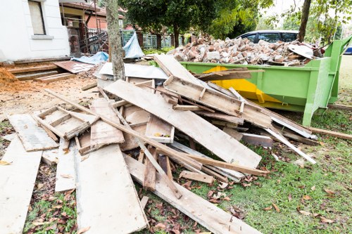 Heavy machinery removing demolition debris in Dulwich